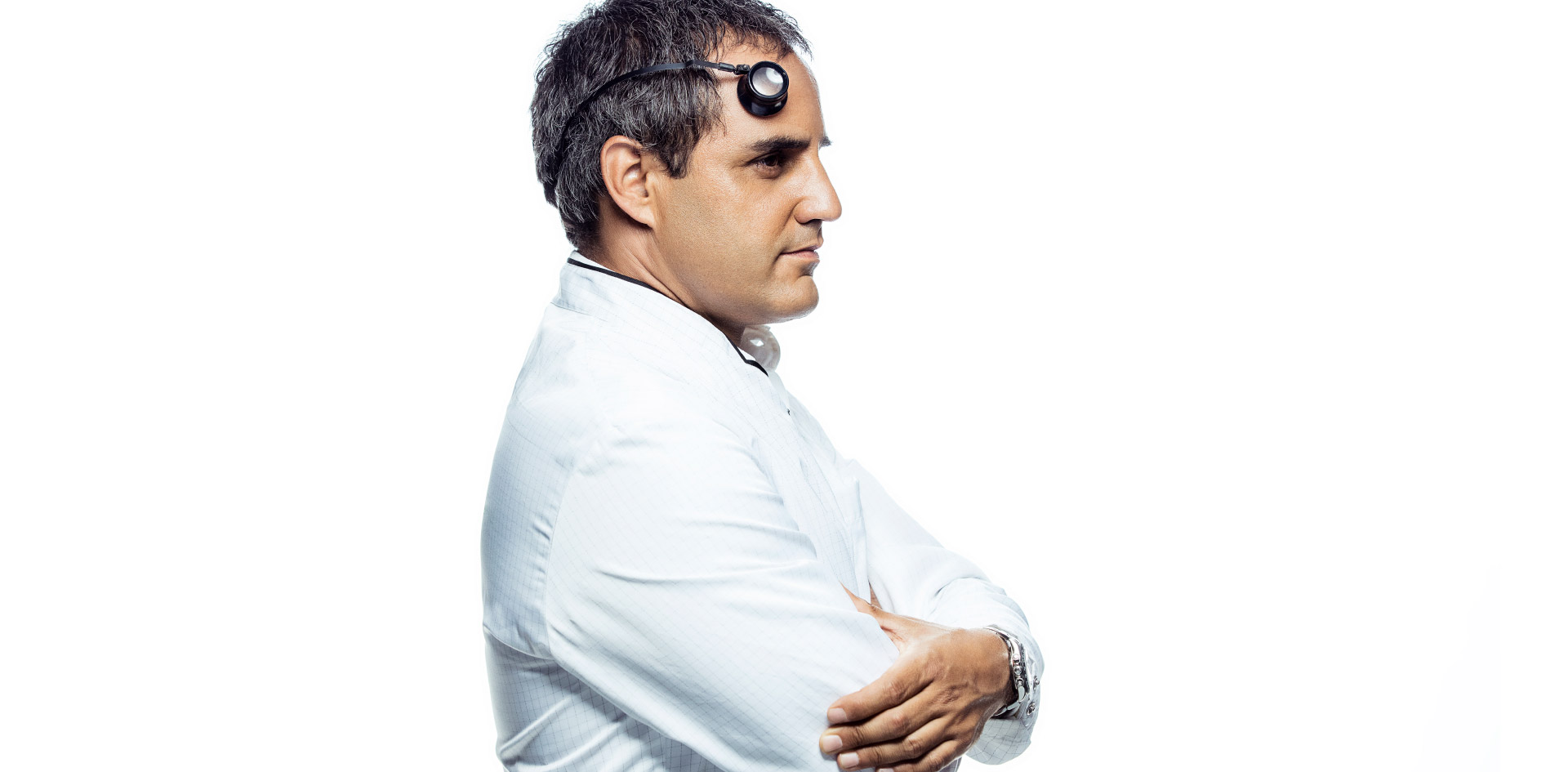 Portrait of Juan Pablo Montoya in a lab coat