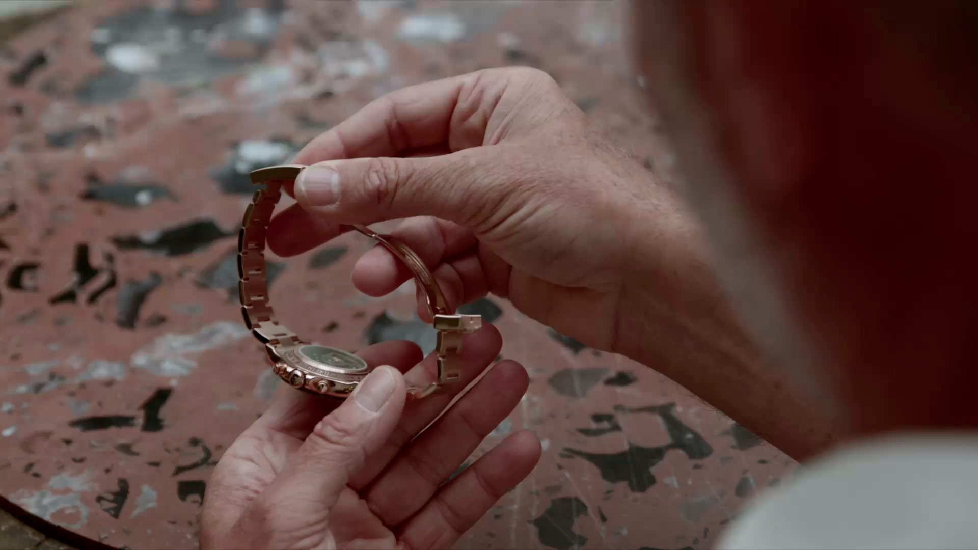 man wearing The Maggiore Challenge, his rose gold Daytona