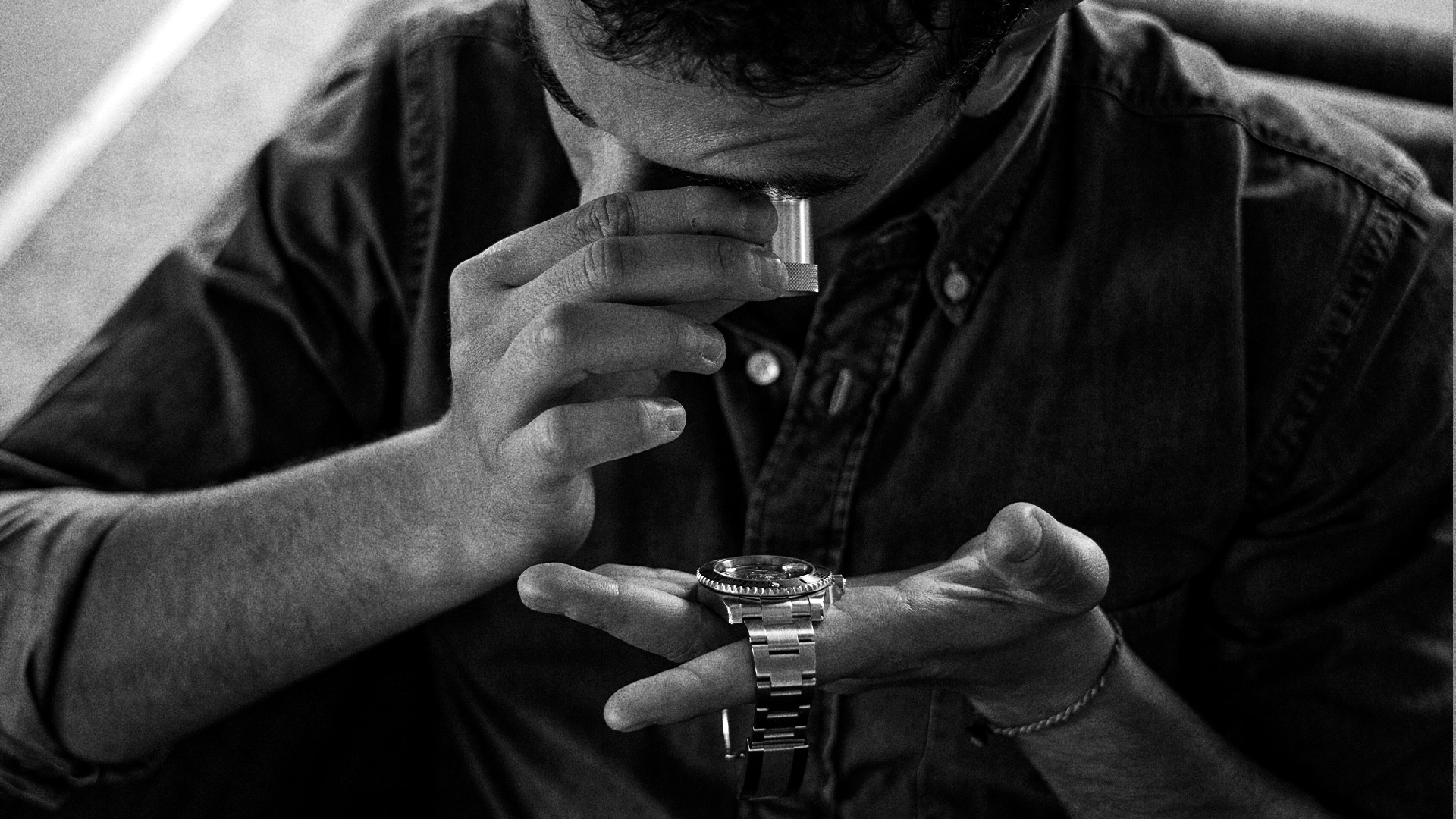 charles passereau looking at his watch